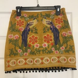 Cute mustard colored skirt with design!